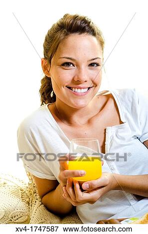 Beautiful girl take a breakfast on the bed in the morning View Large Photo Image Stock Photo - Beautiful girl take a breakfast on the bed in the morning. Fotosearch