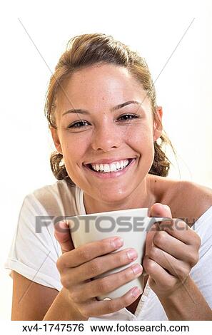 Beautiful girl take a coffee cup breakfast on the bed in the morning View Large Photo Image Stock Photograph - Beautiful girl take a coffee cup breakfast on the bed in the morning. Fotosearch