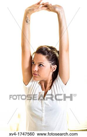 Beautiful girl weak up on bed with arms raised in the morning View Large Photo Image Stock Image - Beautiful girl weak up on bed with arms raised in the morning. Fotosearch