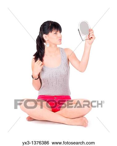 Stock Photograph - Beautiful girl with a mirror. Fotosearch