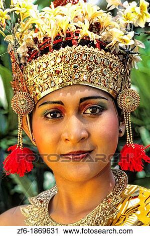 Stock Image - Beautiful golden bride in colorful traditional dress in wedding in Bali Indonesia. Fotosearch