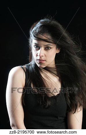 Stock Image - Beautiful Indian woman with long dark hair. Fotosearch
