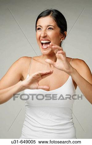 Stock Photography - Beautiful Latin woman screams. Fotosearch