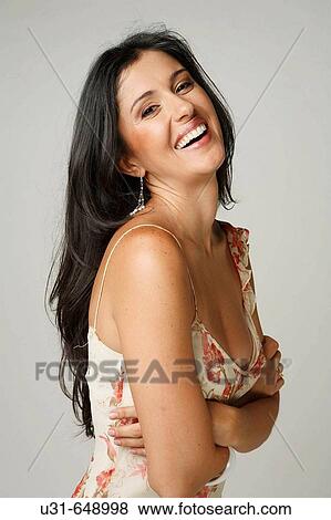 Beautiful Latin woman smiles at the camera View Large Photo Image Stock Photo - Beautiful Latin woman smiles at the camera. Fotosearch