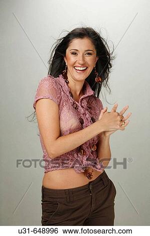 Beautiful Latin woman smiles at the camera View Large Photo Image Stock Photograph - Beautiful Latin woman smiles at the camera. Fotosearch