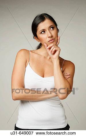 Stock Photo - Beautiful Latin woman thinking. Fotosearch