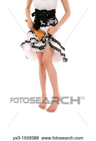 Stock Photo - Beautiful legs of young woman isolated on white background. Fotosearch