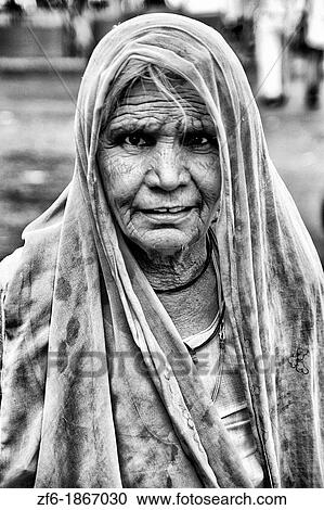 Beautiful old woman with colorful sari dress at Laxmi Narayan Temple near huge Chartarpur Road Temple in New Delhi India View Large Photo Image Stock Image - Beautiful old woman with colorful sari dress at Laxmi Narayan Temple near huge Chartarpur Road Temple in New Delhi India. Fotosearch