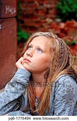Beautiful portrait of a pretty sad girl looking up View Large Photo Image Picture - Beautiful portrait of a pretty sad girl looking up. Fotosearch
