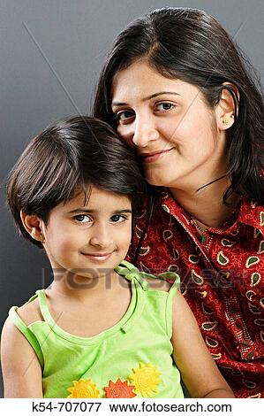 Stock Photo - Beautiful portrait of Indian mother and daughter. Fotosearch
