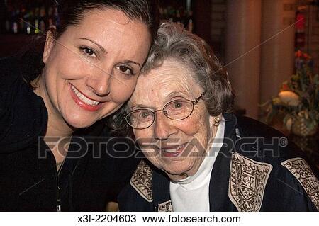 Beautiful woman and her grandmother embracing. Battle Lake Minnesota MN USA. View Large Photo Image Stock Image - Beautiful woman and her grandmother embracing. Battle Lake Minnesota MN USA.. Fotosearch