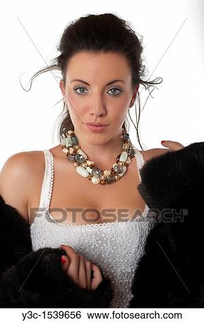 Stock Photograph - Beautiful woman in mink coat. Fotosearch