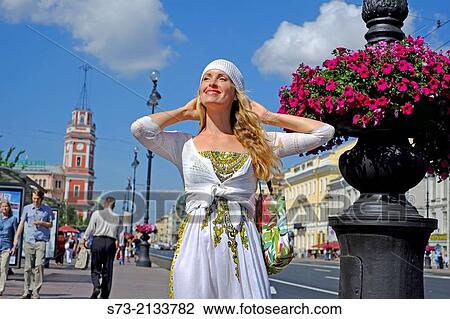 Stock Image - Beautiful woman in Nevski Avenue in Saint Petersburg, Russia. Fotosearch