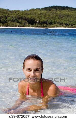 Beautiful woman lying in shallow water. Fraser Island, Australia View Large Photo Image Stock Photo - Beautiful woman lying in shallow water. Fraser Island, Australia. Fotosearch