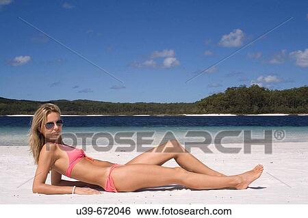 Beautiful woman lying on beach. Fraser Island, Australia View Large Photo Image Stock Photograph - Beautiful woman lying on beach. Fraser Island, Australia. Fotosearch