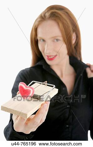 Beautiful woman with a candy heart in mouse trap View Large Photo Image Stock Photograph - Beautiful woman with a candy heart in mouse trap. Fotosearch