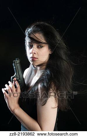 Beautiful woman with a gun. View Large Photo Image Stock Image - Beautiful woman with a gun.. Fotosearch
