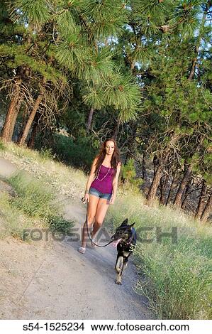 Beautiful young caucasian woman with her German Shepherd dog in Spokane, Washington, USA View Large Photo Image Picture - Beautiful young caucasian woman with her German Shepherd dog in Spokane, Washington, USA. Fotosearch