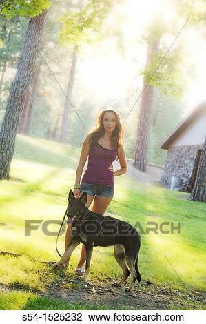 Beautiful young caucasian woman with her German Shepherd dog in Spokane, Washington, USA View Large Photo Image Stock Image - Beautiful young caucasian woman with her German Shepherd dog in Spokane, Washington, USA. Fotosearch