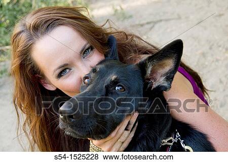Beautiful young caucasian woman with her German Shepherd dog in Spokane, Washington, USA View Large Photo Image Stock Photo - Beautiful young caucasian woman with her German Shepherd dog in Spokane, Washington, USA. Fotosearch