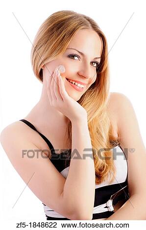 Beautiful young woman applying moisturizer View Large Photo Image Stock Image - Beautiful young woman applying moisturizer. Fotosearch