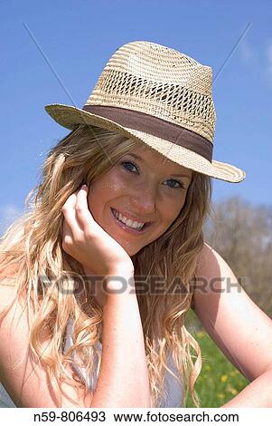 Beautiful young woman enjoying being outside in early spring sunshine View Large Photo Image Stock Image - Beautiful young woman enjoying being outside in early spring sunshine. Fotosearch