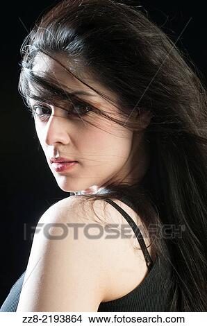 Picture - Beautiful young woman hair covering face.. Fotosearch