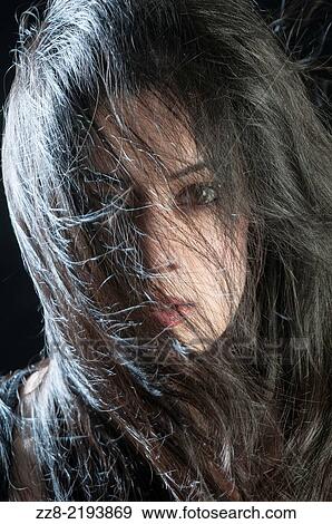 Beautiful young woman hair covering face. View Large Photo Image Stock Photo - Beautiful young woman hair covering face.. Fotosearch