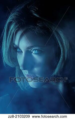 Beautiful young woman looking away in the mist. View Large Photo Image Stock Photo - Beautiful young woman looking away in the mist.. Fotosearch