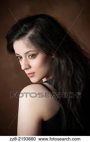 Beautiful young woman lost in thought. View Large Photo Image Stock Image - Beautiful young woman lost in thought.. Fotosearch