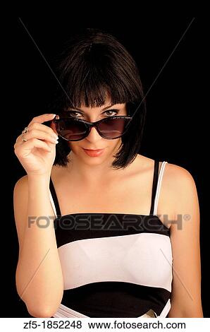 Stock Photo - Beautiful young woman wearing sunglasses. Fotosearch