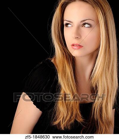 Beautiful young woman with long blond hair View Large Photo Image Stock Image - Beautiful young woman with long blond hair. Fotosearch