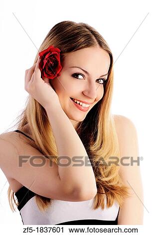Beautiful young woman with rose in her hair View Large Photo Image Stock Image - Beautiful young woman with rose in her hair. Fotosearch