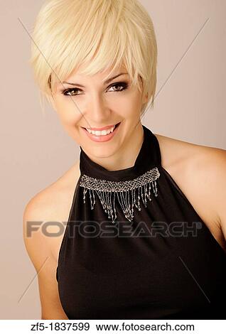 Beautiful young woman with short blond hair View Large Photo Image Stock Photo - Beautiful young woman with short blond hair. Fotosearch