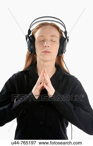 Stock Photo - Beautifull woman with headphones and relaxing music. Fotosearch
