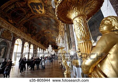 Beautifully guilded lamps decorating the Hall of Mirrors in Chateau of Versailles, Paris. France View Large Photo Image Picture - Beautifully guilded lamps decorating the Hall of Mirrors in Chateau of Versailles, Paris. France. Fotosearch