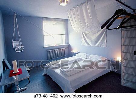 Stock Image - Bedroom in Kukuun art hotel, St. Pauli district, Hamburg. Germany. Fotosearch