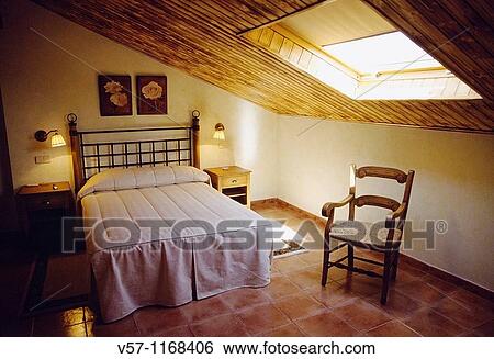 Stock Photograph - Bedroom in rural house. Fotosearch