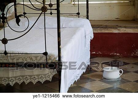 Stock Photograph - Bedroom inside the Museum of Colonial Architecture, Trinidad, Sancti Spiritus, Cuba.. Fotosearch