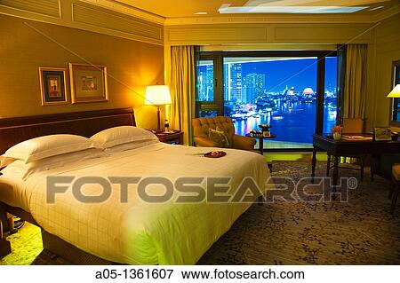 Stock Photo - Bedroom with the evening over the Mae Nam Chao Phraya river view Mandarin Oriental Hotel, Silom District, Bangkok, Thailand, Southeast Asia, Asia.. Fotosearch