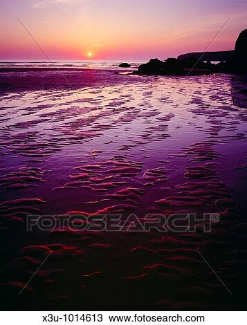 Bedruthan Steps at sunset near Newquay, Cornwall, England, United Kingdom View Large Photo Image Stock Image - Bedruthan Steps at sunset near Newquay, Cornwall, England, United Kingdom. Fotosearch