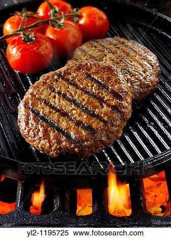 Beef burgers being cooked View Large Photo Image Stock Photography - Beef burgers being cooked. Fotosearch