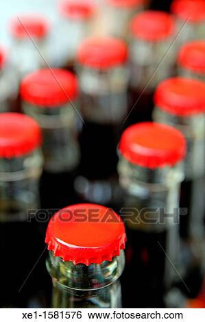 Stock Photograph - Beer bottles, red plates. Fotosearch