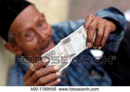 Stock Photograph - Beggar on the street, Jakarta, Indonesia, Southeast Asia. Fotosearch
