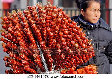 Beijing (China): candied fruit seller during the Lunar New Year period (Spring Festival) View Large Photo Image Stock Photo - Beijing (China): candied fruit seller during the Lunar New Year period (Spring Festival). Fotosearch