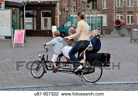 Belgium, Flanders, Ghent, Mother and Children on Bicycle View Large Photo Image Stock Image - Belgium, Flanders, Ghent, Mother and Children on Bicycle. Fotosearch