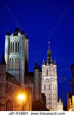 Stock Image - Belgium, Flanders, Ghent, St. Nicholas? Church and Lakenhalle from St. Michael's bridge at Dusk. Fotosearch