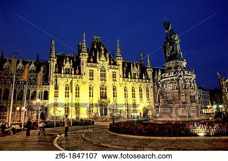Stock Photo - Belgium night photo of House of Governor or Provence House in Marketplace in downtown Bruges Belgium. Fotosearch