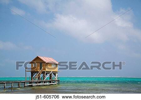 BELIZE San Pedro on Ambergris Caye Colorful wooden building on stilts, end of dock, Caribbean waters View Large Photo Image Stock Photograph - BELIZE San Pedro on Ambergris Caye Colorful wooden building on stilts, end of dock, Caribbean waters. Fotosearch
