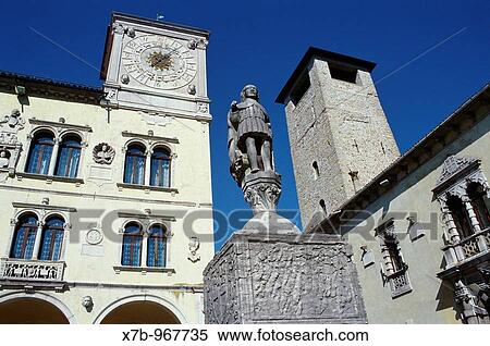 Stock Photography - Belluno Italy Palazzo dei Rettori left, statue of San Joata on the central fountain, and the Torre Civica right. Fotosearch